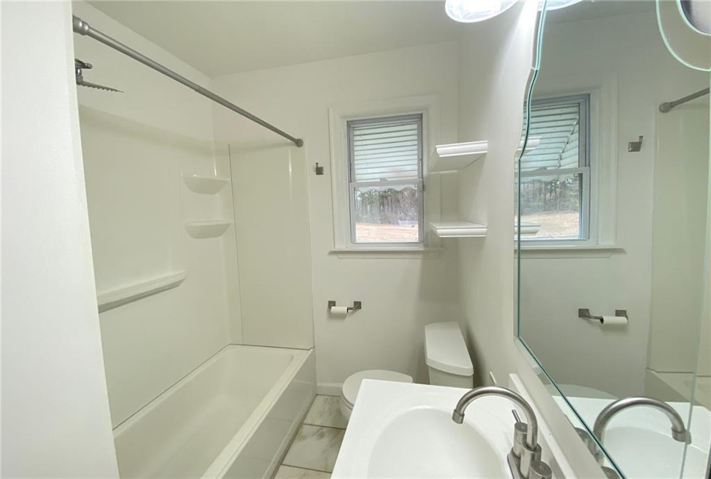 330 Community Drive Mableton, GA 30126 - Photo 32 of 47 a bathroom with a sink toilet and shower