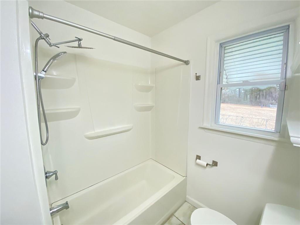 330 Community Drive Mableton, GA 30126 - Photo 33 of 47 a bathroom with a shower and a toilet