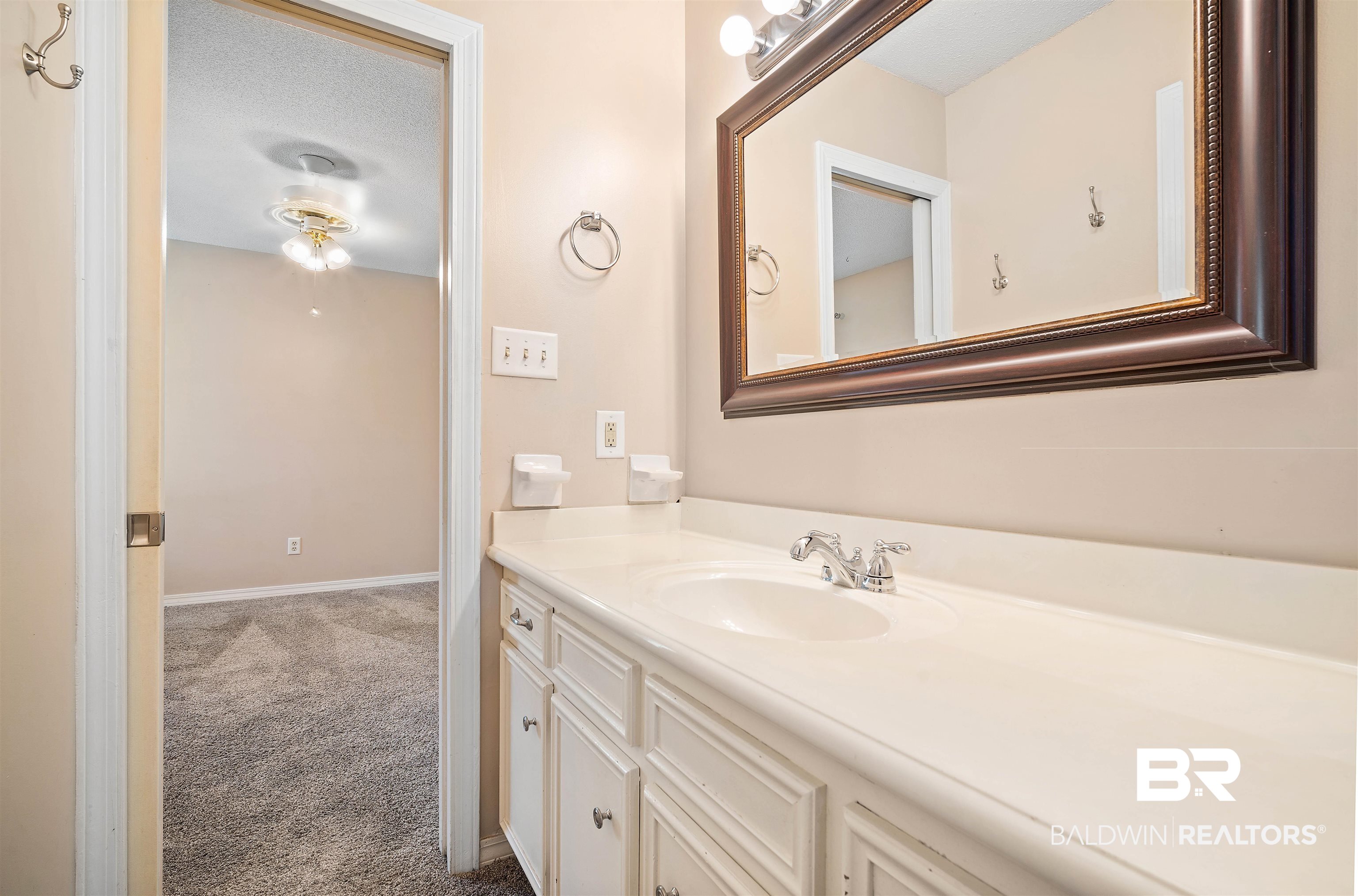 804 Wildwood Avenue Mobile, AL 36609 - Photo 23 of 30 Bathroom featuring a textured ceiling and vanity
