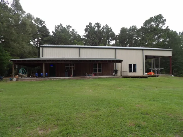 a front view of a house with a yard and porch