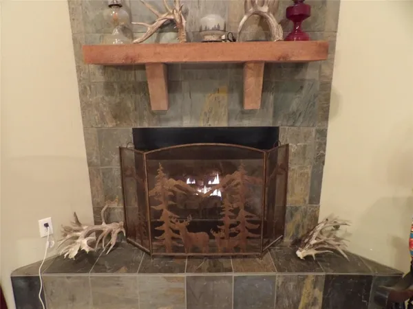 a kitchen with stainless steel appliances a refrigerator and wooden cabinets