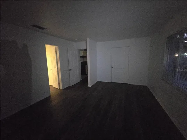 a view of an empty room and window