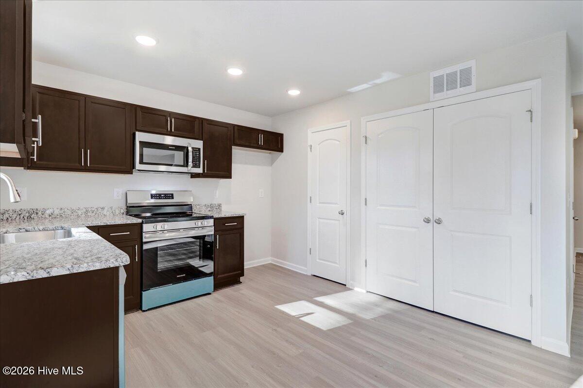 11379 Red Bud Road Castalia, NC 27816 - Photo 27 of 29 Stainless Steel appliances - the blue is the protective film
