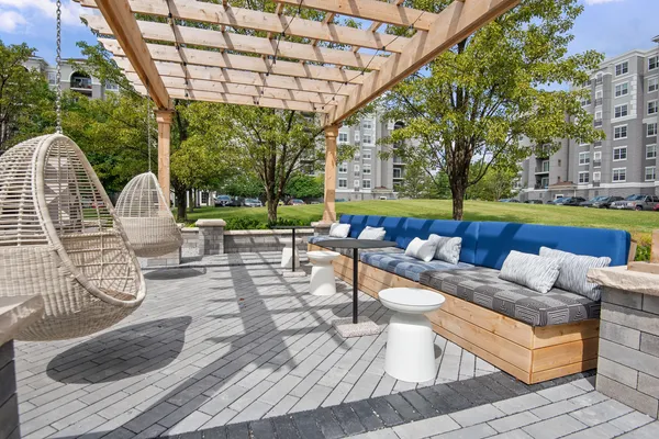 a view of swimming pool with outdoor seating and plants