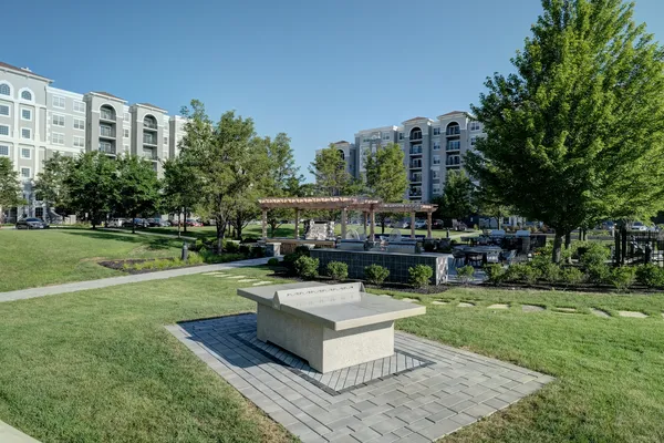 a view of a house with a yard deck and sitting area