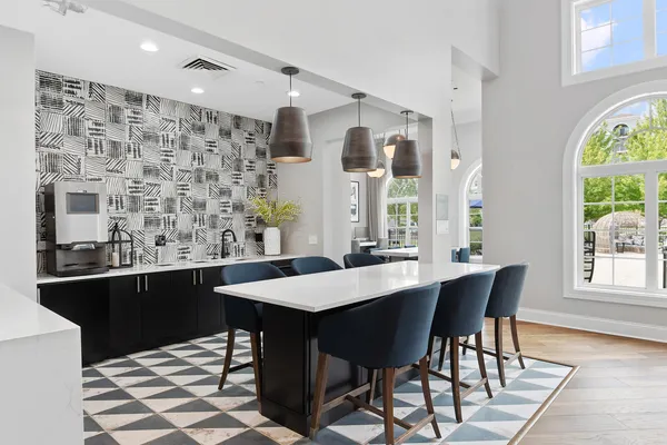 a view of a dining room with furniture and window
