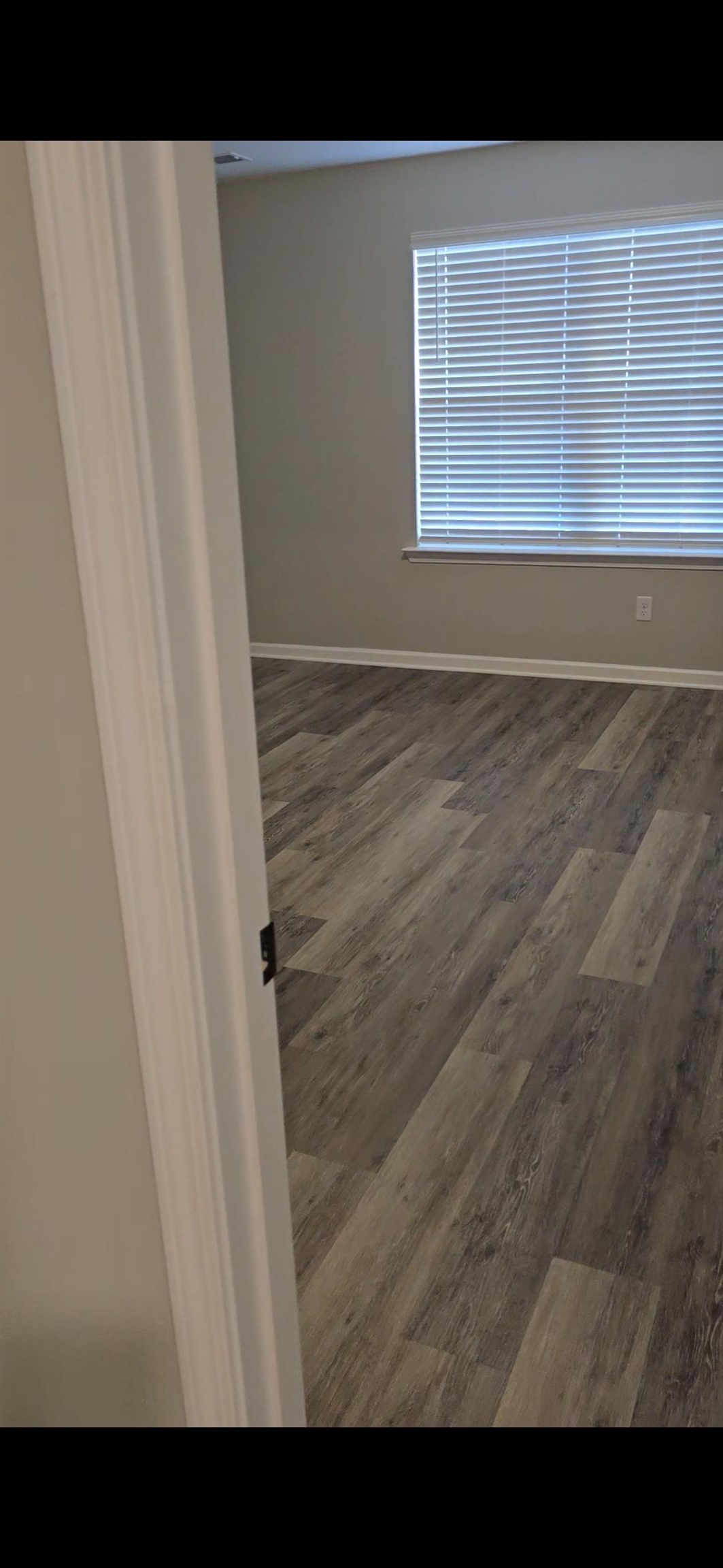 10160 Sterling Ridge Drive Cordova, TN 38018 - Photo 22 of 35 a view of wooden floor in a white cabinet