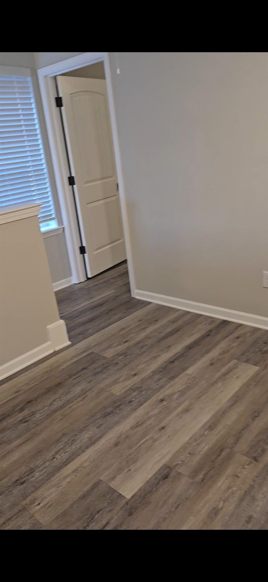 10160 Sterling Ridge Drive Cordova, TN 38018 - Photo 10 of 35 a view of an empty room with wooden floor