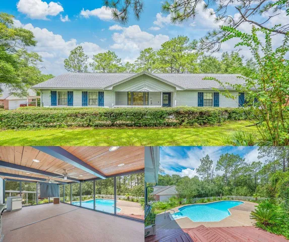 a view of a house with swimming pool and a yard