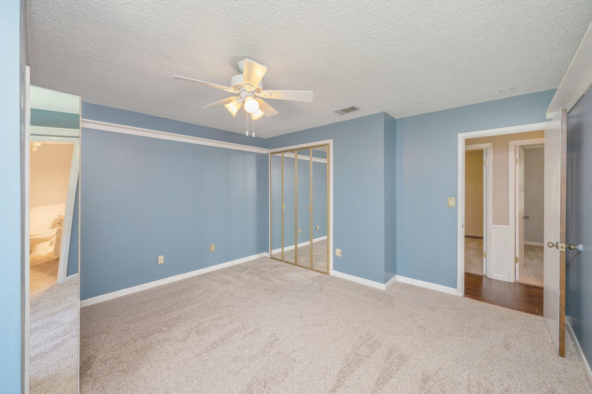 5770 Wildwood Road Crestview, FL 32536 - Photo 19 of 39 a view of a livingroom with a chandelier fan