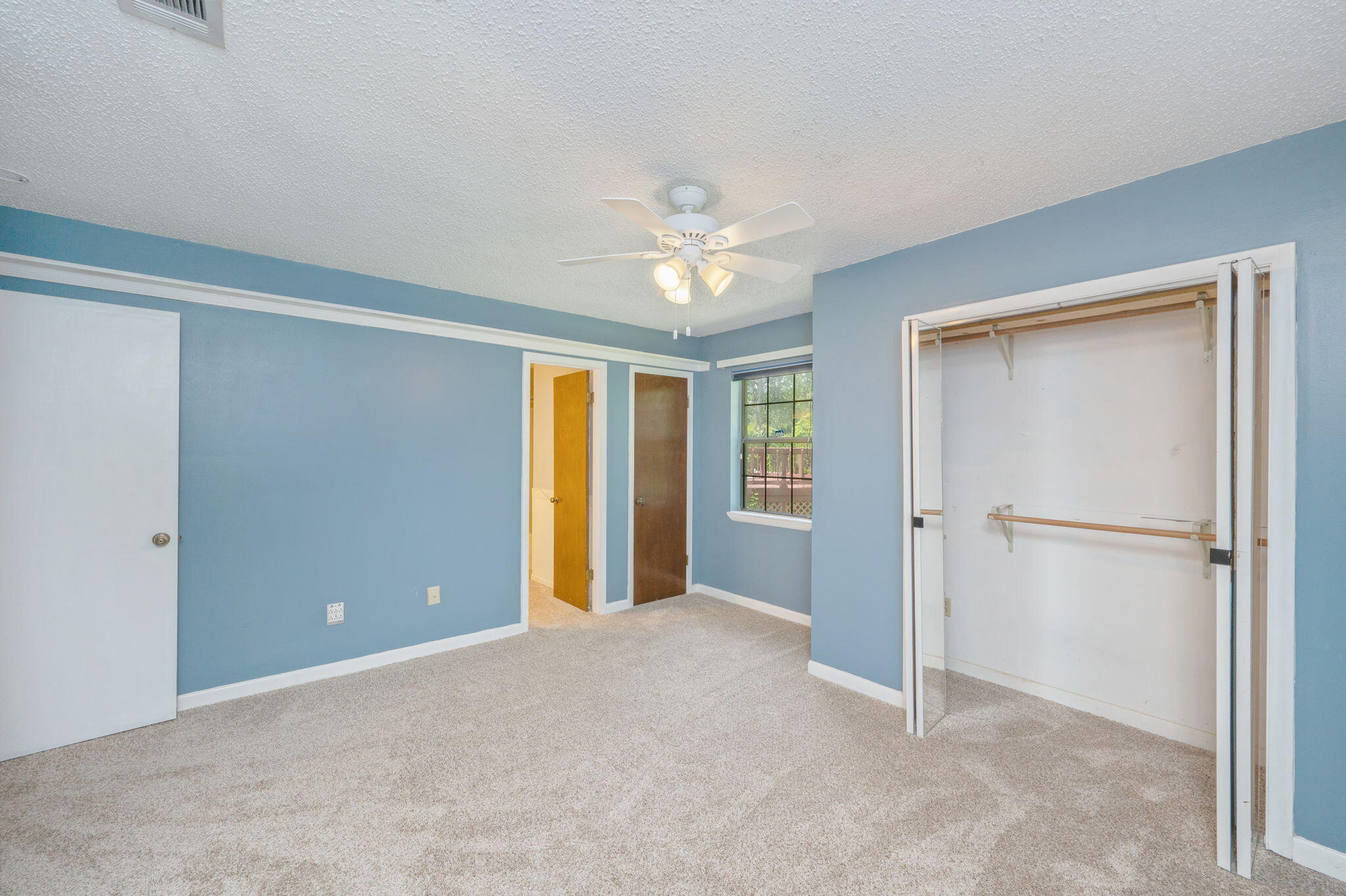 5770 Wildwood Road Crestview, FL 32536 - Photo 20 of 39 a view of an empty room with a window