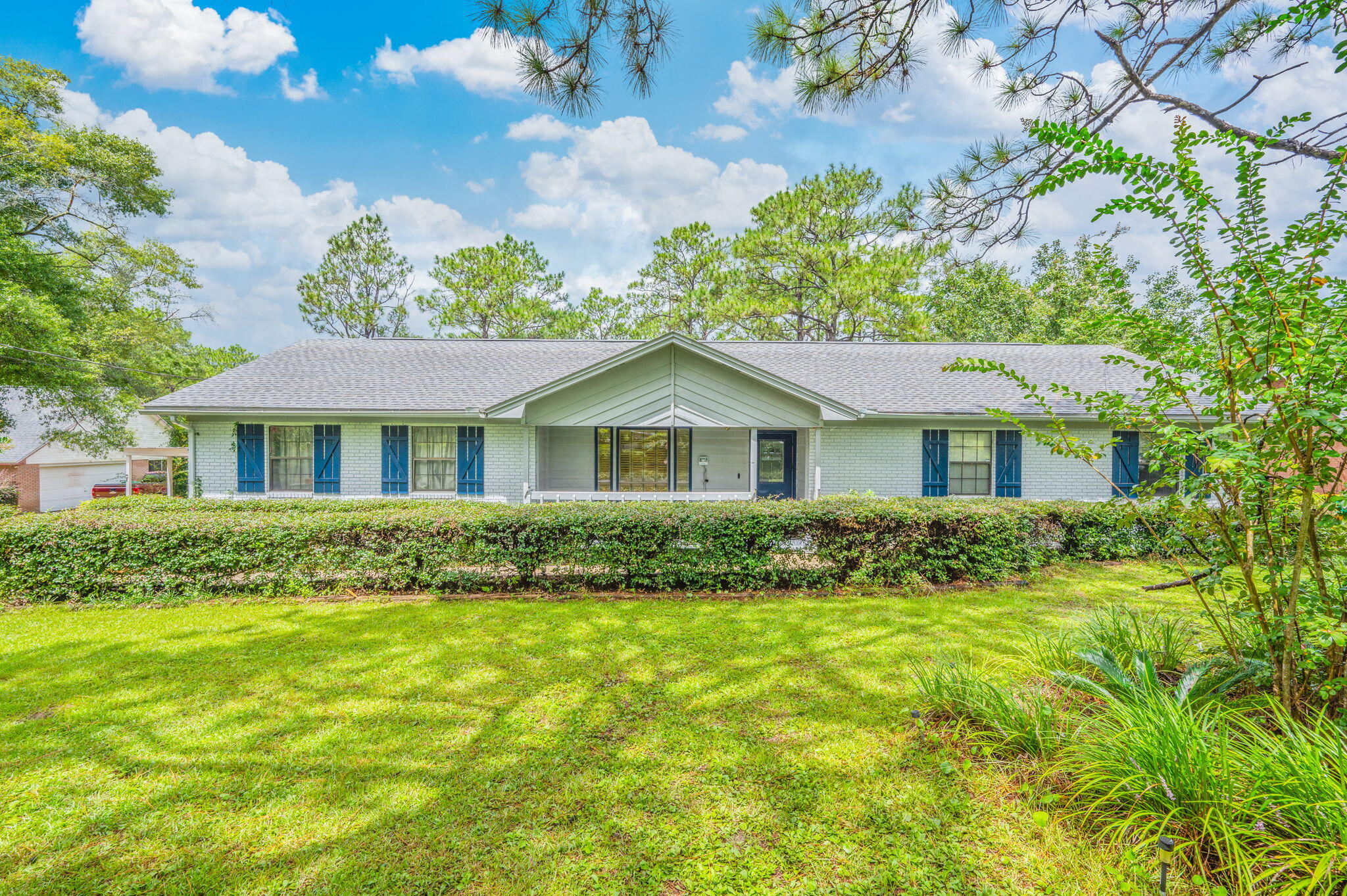 5770 Wildwood Road Crestview, FL 32536 - Photo 2 of 39 a front view of house with yard and green space
