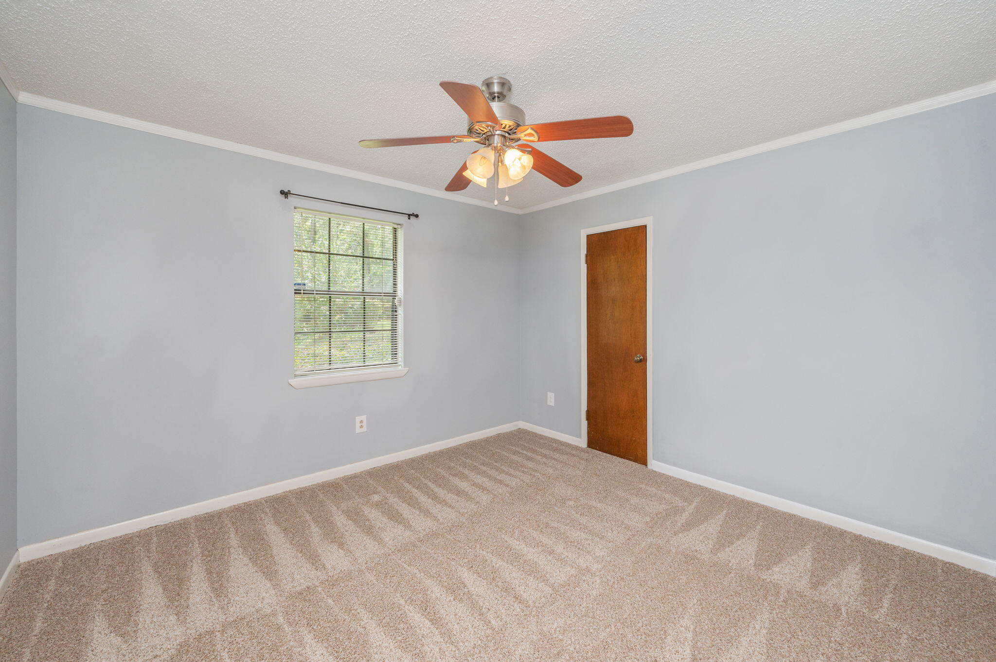 5770 Wildwood Road Crestview, FL 32536 - Photo 23 of 39 wooden floor in an empty room with a window