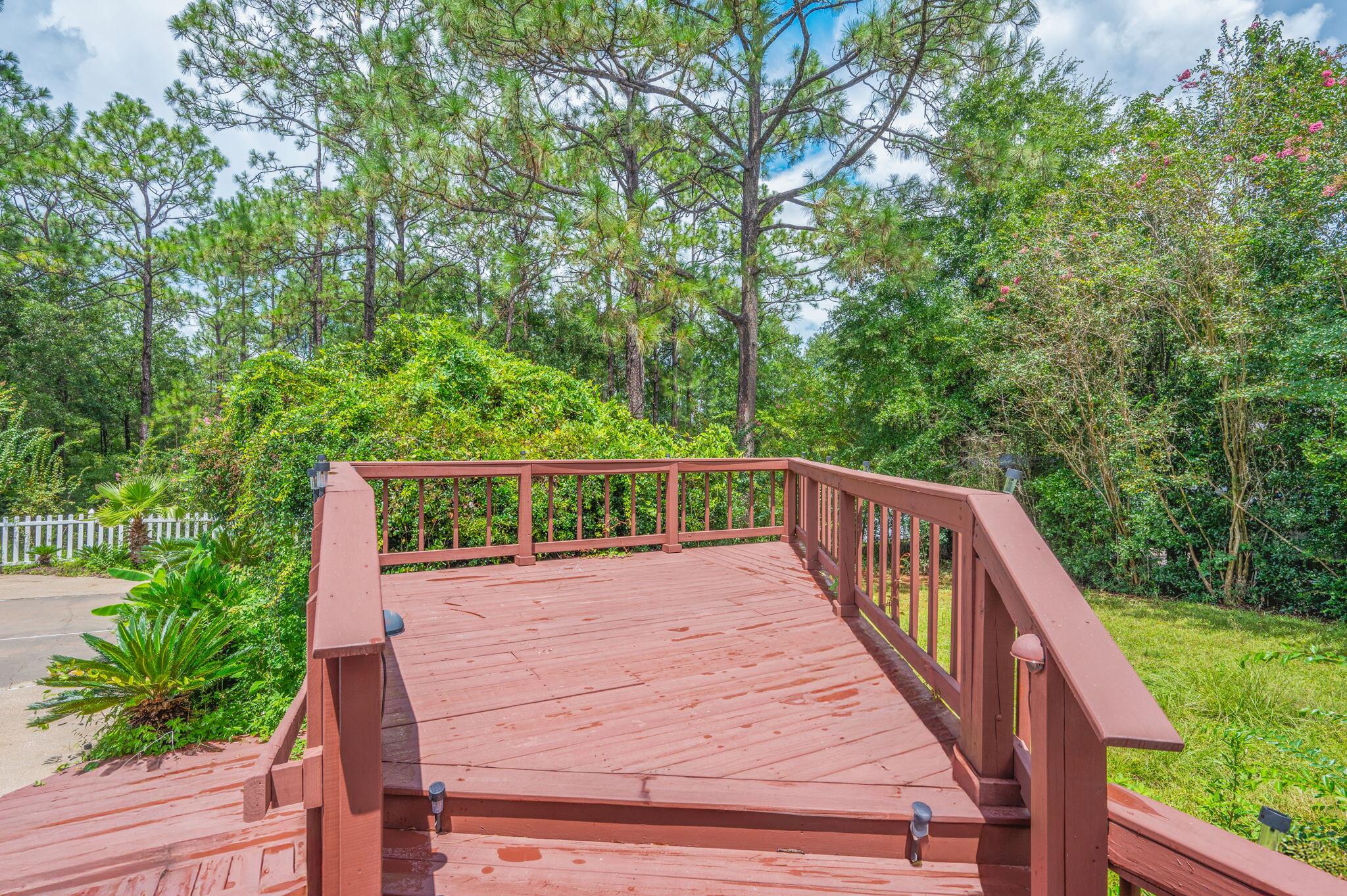 5770 Wildwood Road Crestview, FL 32536 - Photo 36 of 39 a view of balcony with wooden floor and fence