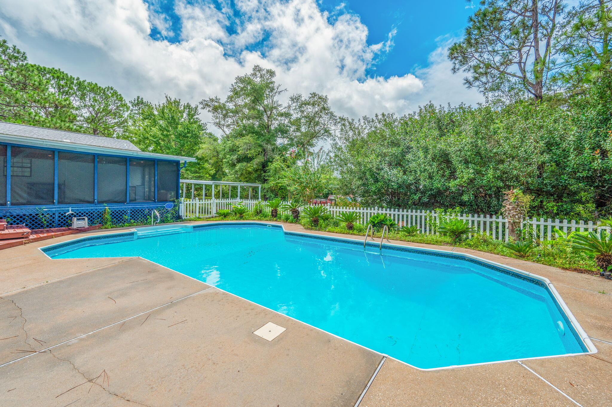 5770 Wildwood Road Crestview, FL 32536 - Photo 37 of 39 a view of an outdoor space and a swimming pool