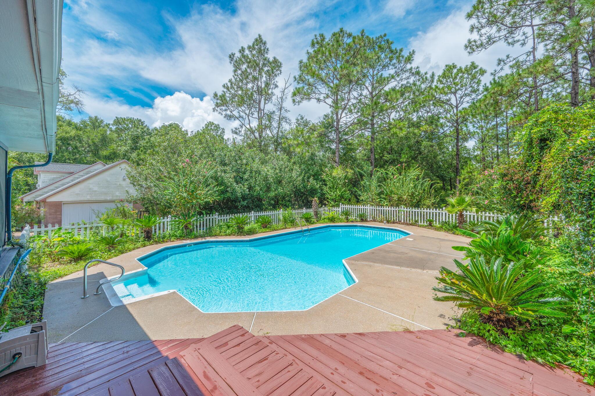 5770 Wildwood Road Crestview, FL 32536 - Photo 38 of 39 a view of a swimming pool with a patio