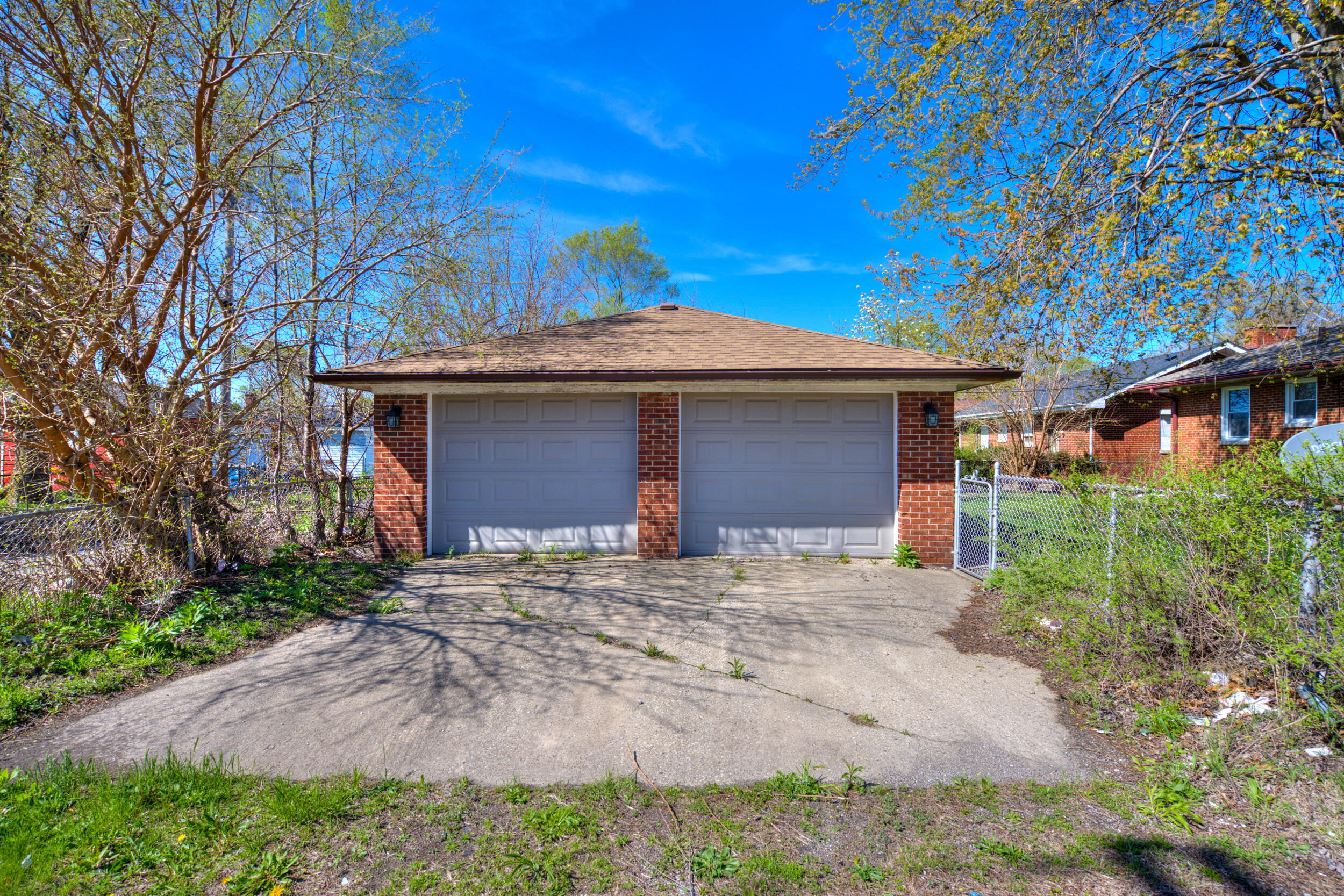 3816 Lincoln Street Gary, IN 46408 - Photo 20 of 21 a front view of a house with a garden and yard