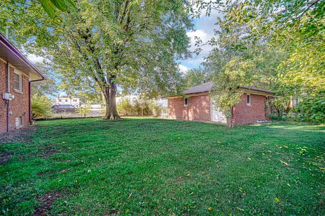 a backyard of a house with lots of green space