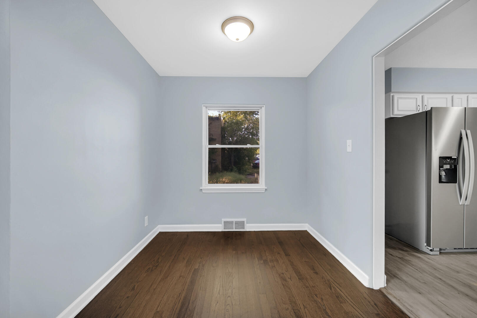 3816 Lincoln Street Gary, IN 46408 - Photo 6 of 21 wooden floor in an empty room with a window