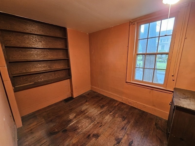 23 High Street Monson, MA 01057 - Photo 15 of 29 a view of empty room with wooden floor and fan