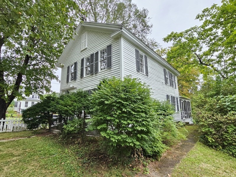 23 High Street Monson, MA 01057 - Photo 2 of 29 a front view of a house with a yard