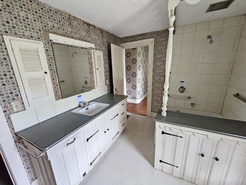 23 High Street Monson, MA 01057 - Photo 26 of 29 a bathroom with a double vanity sink mirror and bathtub