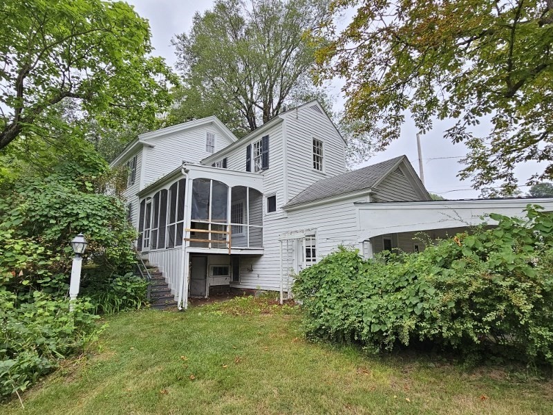 23 High Street Monson, MA 01057 - Photo 3 of 29 a front view of a house with a yard