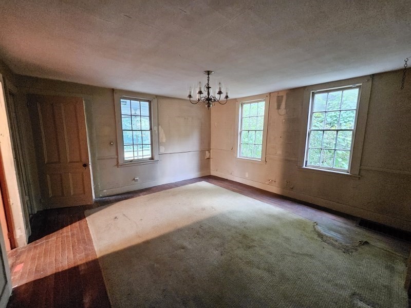 23 High Street Monson, MA 01057 - Photo 6 of 29 an empty room with windows and closet