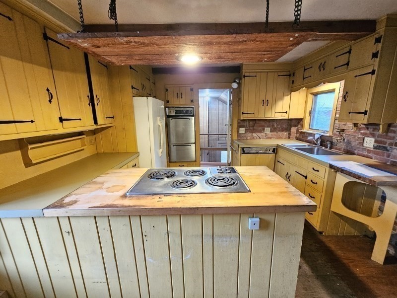 23 High Street Monson, MA 01057 - Photo 9 of 29 a kitchen with a sink and cabinets
