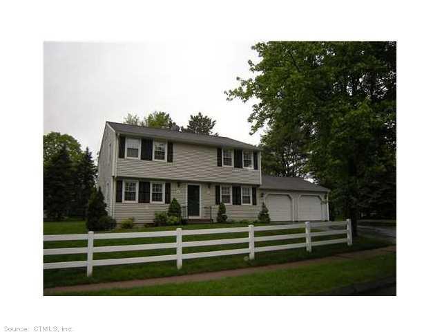 10 Addison Pond Road, Unit 10 Glastonbury, CT 06033 - Photo 1 of 1 a view of a house with a yard