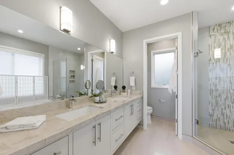 a bathroom with a tub shower and sink