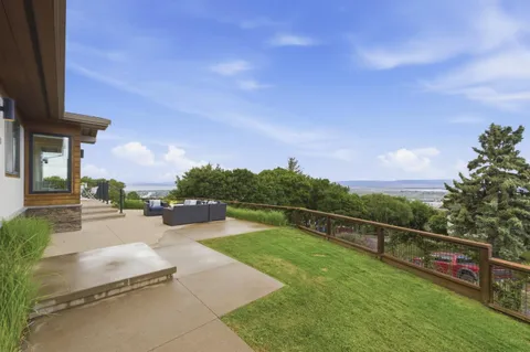 a view of a patio with a table and chairs