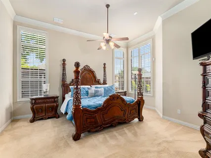a bed room with furniture and a flat screen tv