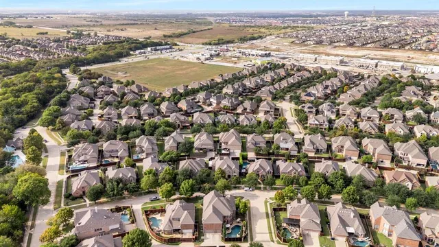 an aerial view of residential building and parking space
