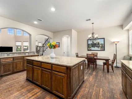 a kitchen with a stove and cabinets