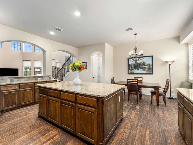 a kitchen with a stove and cabinets