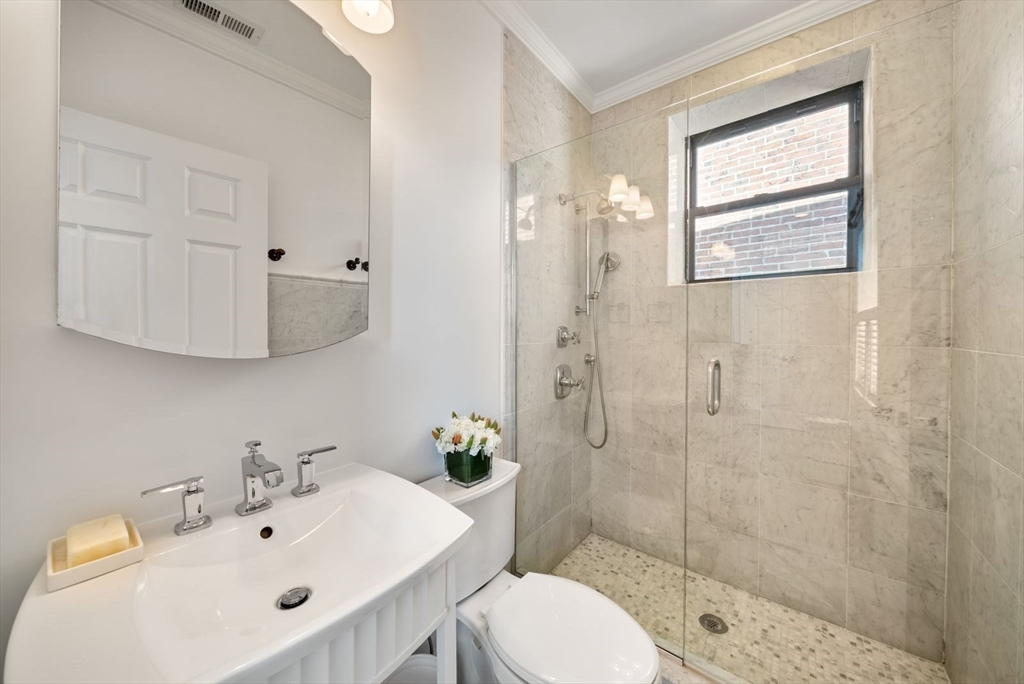 35 Rutherford Avenue, Unit 3 Boston, MA 02129 - Photo 15 of 28 a bathroom with a sink toilet and shower