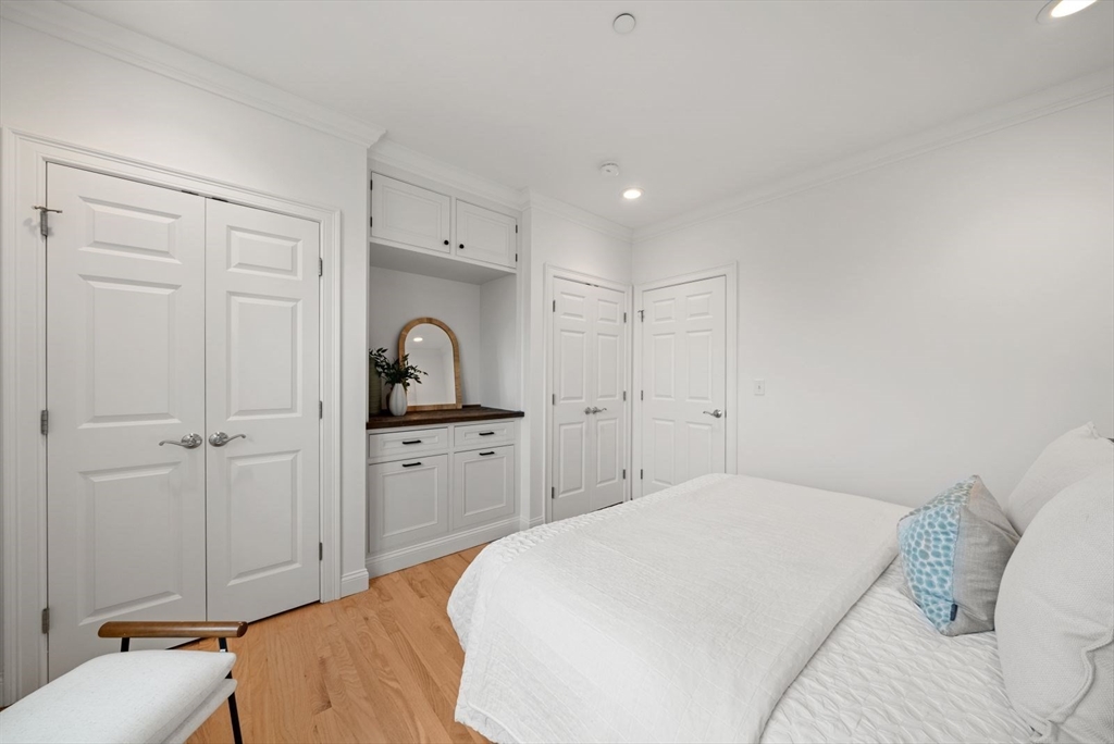 35 Rutherford Avenue, Unit 3 Boston, MA 02129 - Photo 16 of 28 a bedroom with a bed and a sink