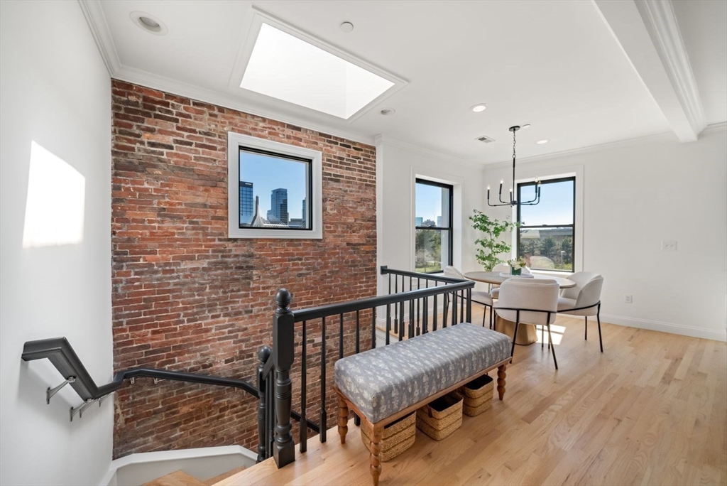 35 Rutherford Avenue, Unit 3 Boston, MA 02129 - Photo 10 of 28 a living room with furniture a window and a table