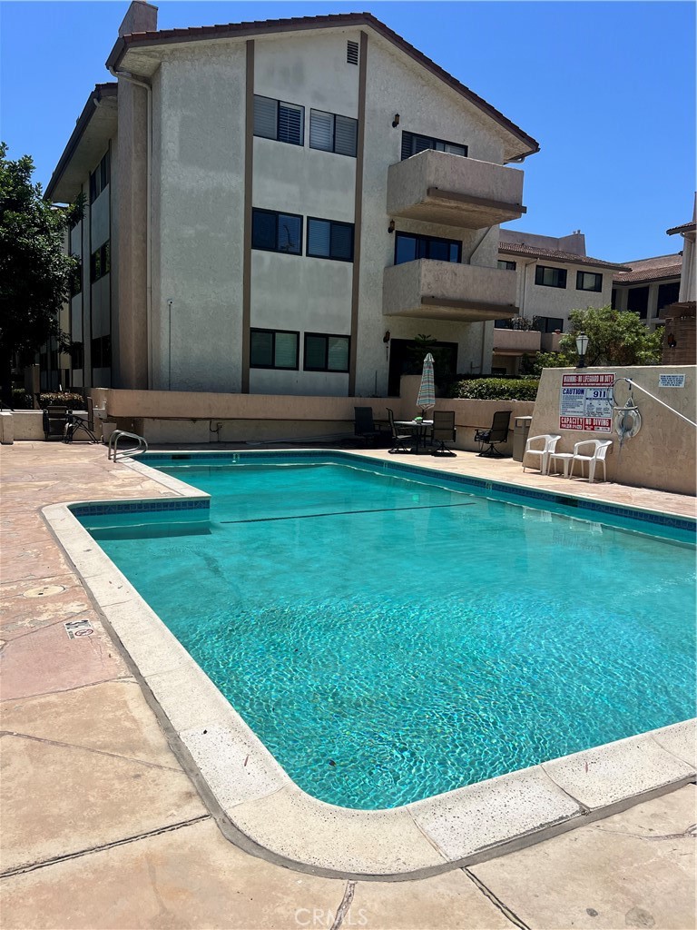 12300 Montecito Road, Unit 24 Seal Beach, CA 90740 - Photo 8 of 8 a view of a house with a backyard