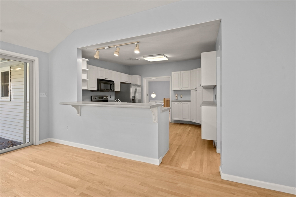 10 Strawberry Hill Road Andover, MA 01810 - Photo 15 of 41 a view of kitchen with microwave and cabinets