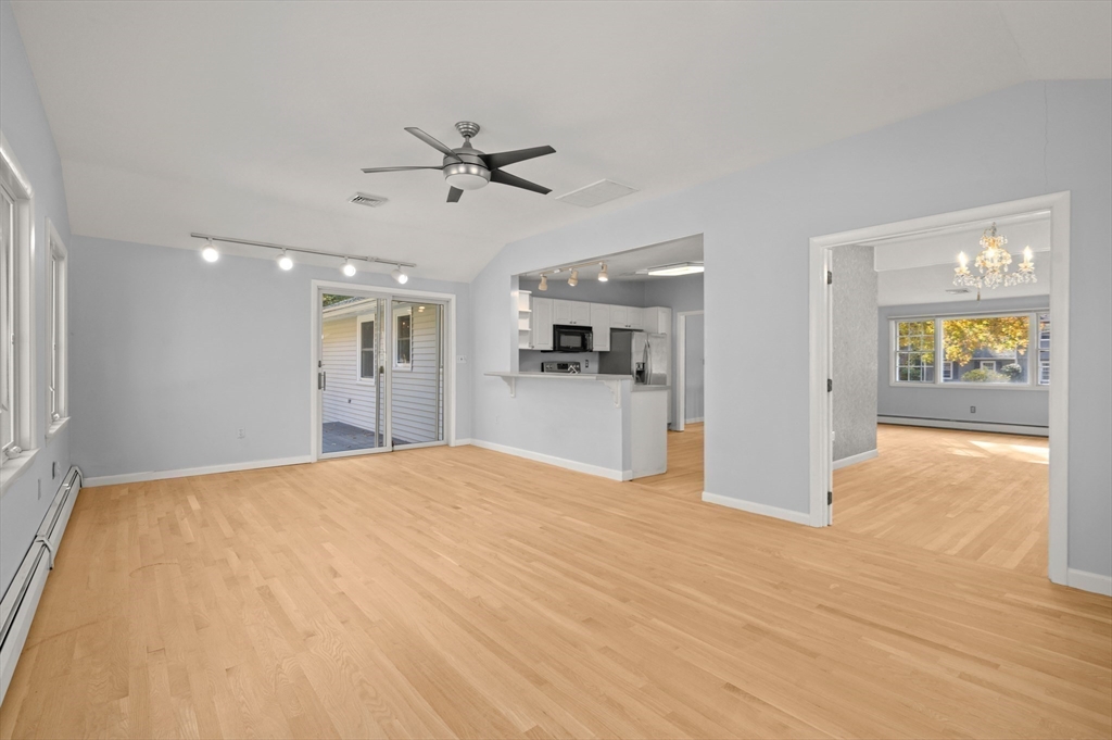 10 Strawberry Hill Road Andover, MA 01810 - Photo 18 of 41 a view of an empty room with window and wooden floor
