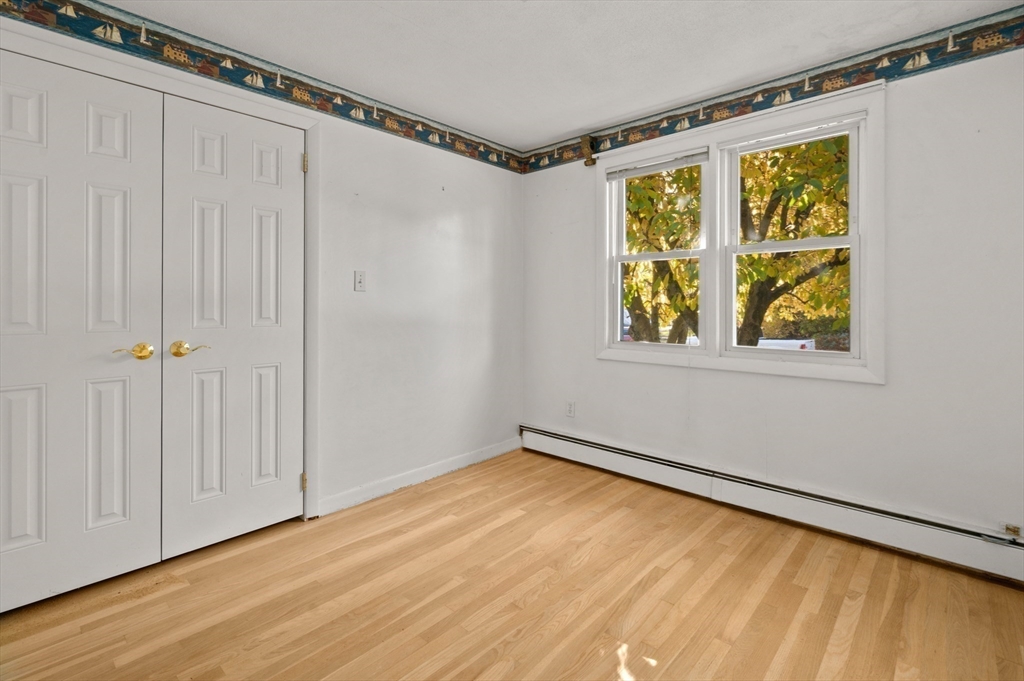 10 Strawberry Hill Road Andover, MA 01810 - Photo 22 of 41 a view of an empty room with a window