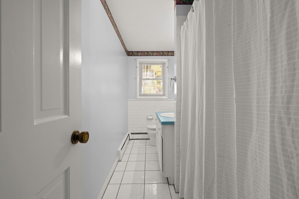 10 Strawberry Hill Road Andover, MA 01810 - Photo 23 of 41 a bathroom with a window