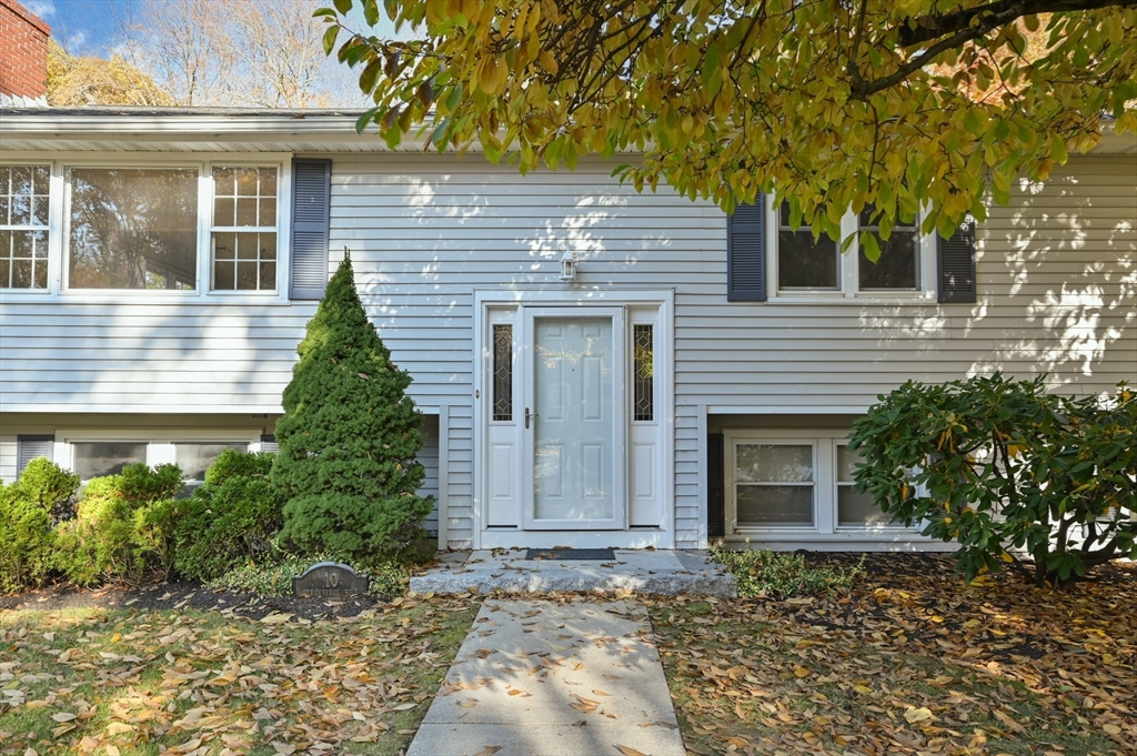10 Strawberry Hill Road Andover, MA 01810 - Photo 3 of 41 a front view of a house with garden