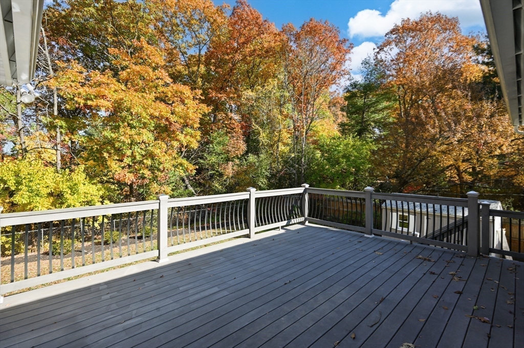 10 Strawberry Hill Road Andover, MA 01810 - Photo 33 of 41 a view of a roof deck with wooden floor and fence