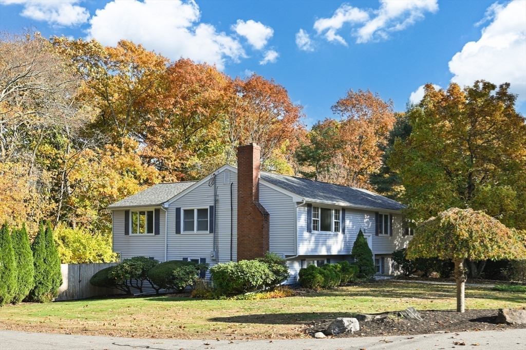 10 Strawberry Hill Road Andover, MA 01810 - Photo 35 of 41 a front view of a house with a yard
