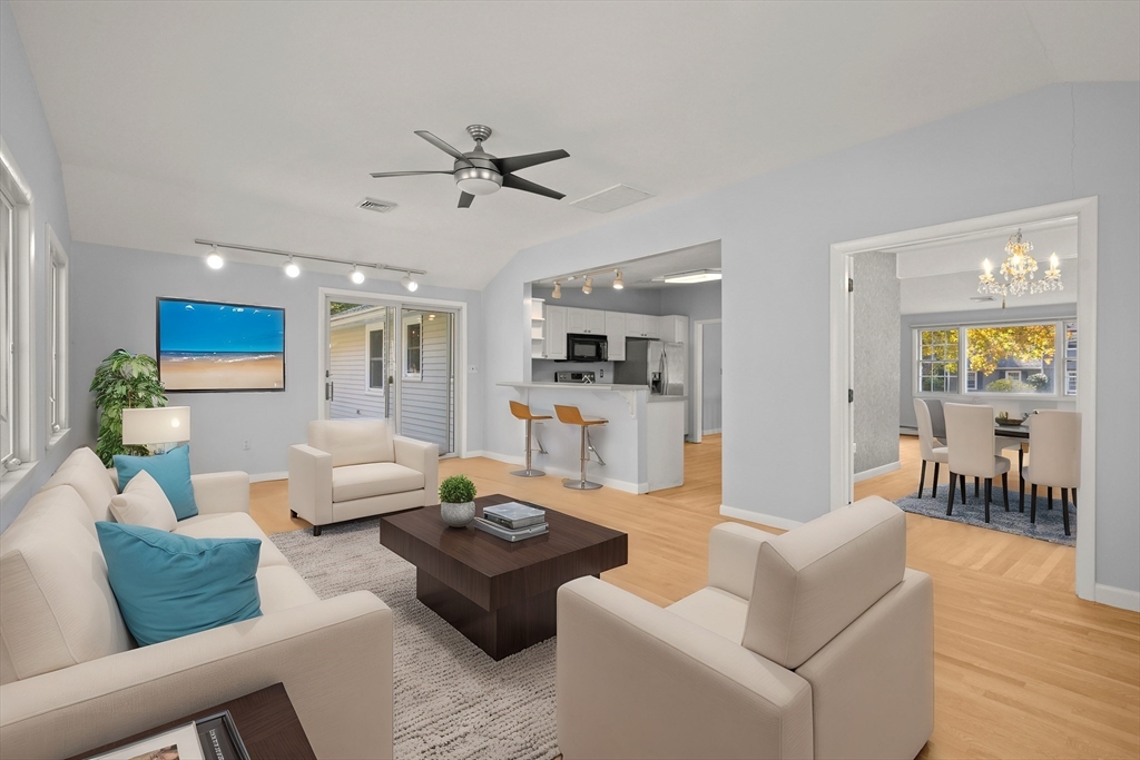 10 Strawberry Hill Road Andover, MA 01810 - Photo 5 of 41 a living room with furniture and wooden floor
