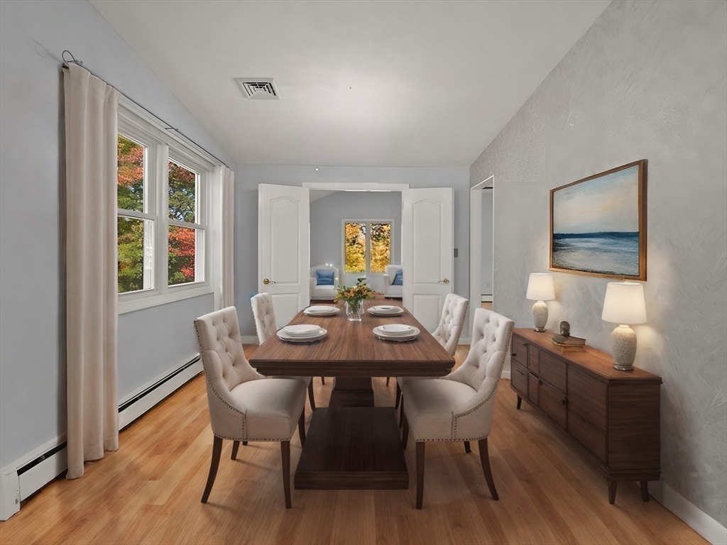10 Strawberry Hill Road Andover, MA 01810 - Photo 6 of 41 a view of a dining room with furniture and wooden floor
