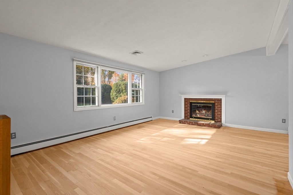 10 Strawberry Hill Road Andover, MA 01810 - Photo 8 of 41 an empty room with windows